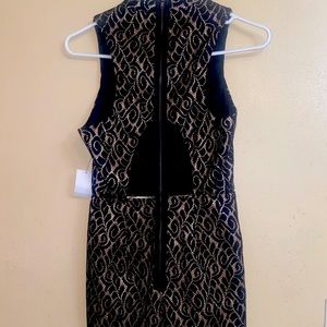 Sleeveless mock neck romper from Charlotte Russe. Black & gold glitter detail.